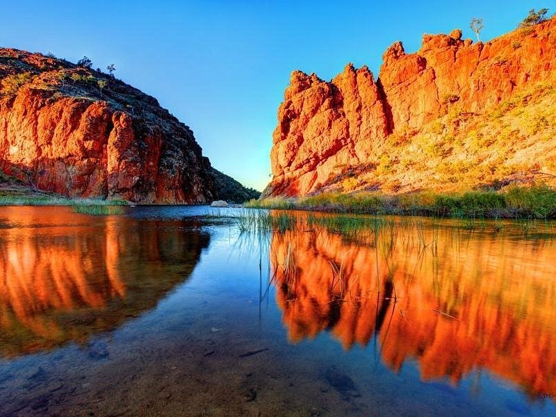 Red gorge walls reflected in still water in the West MacDonnell Ranges
