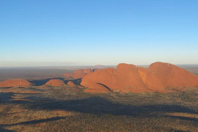 Kata Tjuta in flat early light, the domes stepping down to the horizon