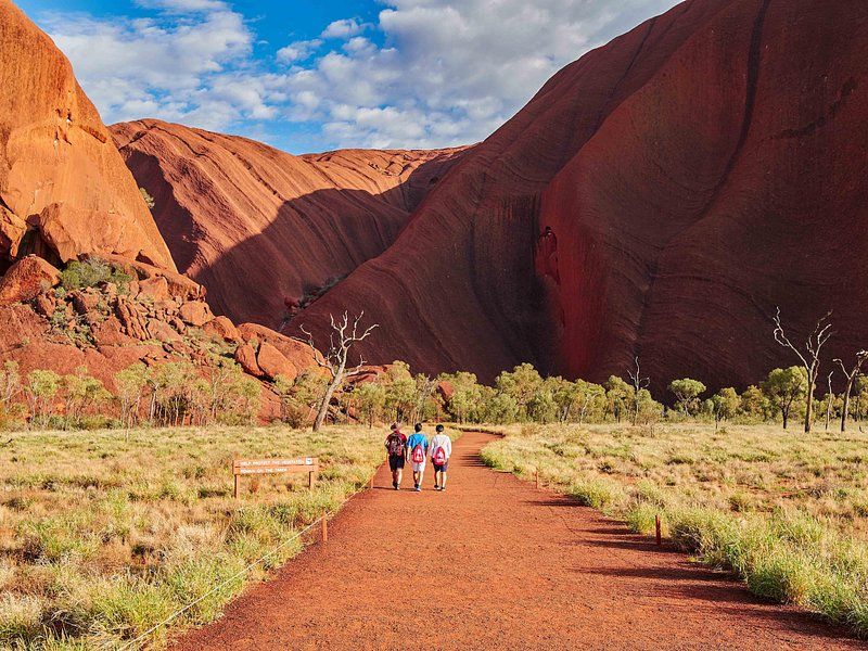 The rocky track into Walpa Gorge with walkers small against the rock