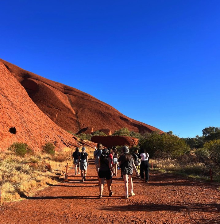 Walkers on the Mala track at the base of Uluru
